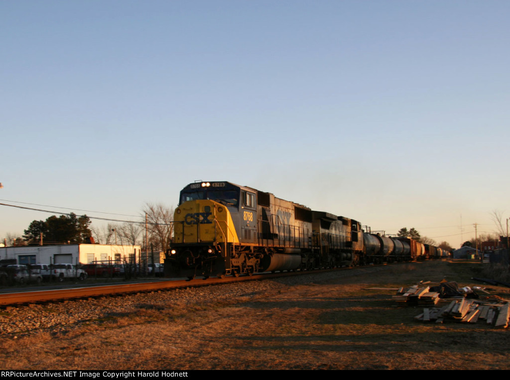 CSX 8768 leads a train southbound early in the morning